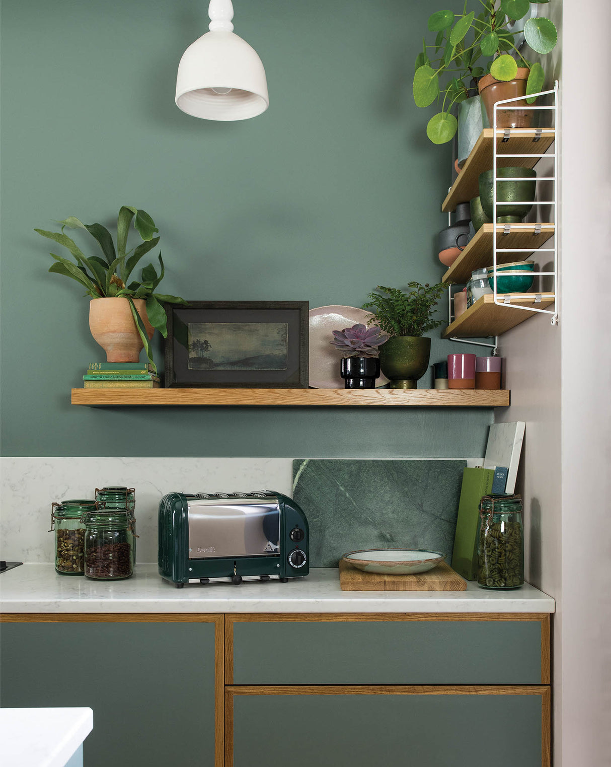 DUALIT Toaster NEWGEN mit 4 Scheiben, grüner Edelstahl, modernes Design, zeigt die Toastschlitze und Bedienelemente