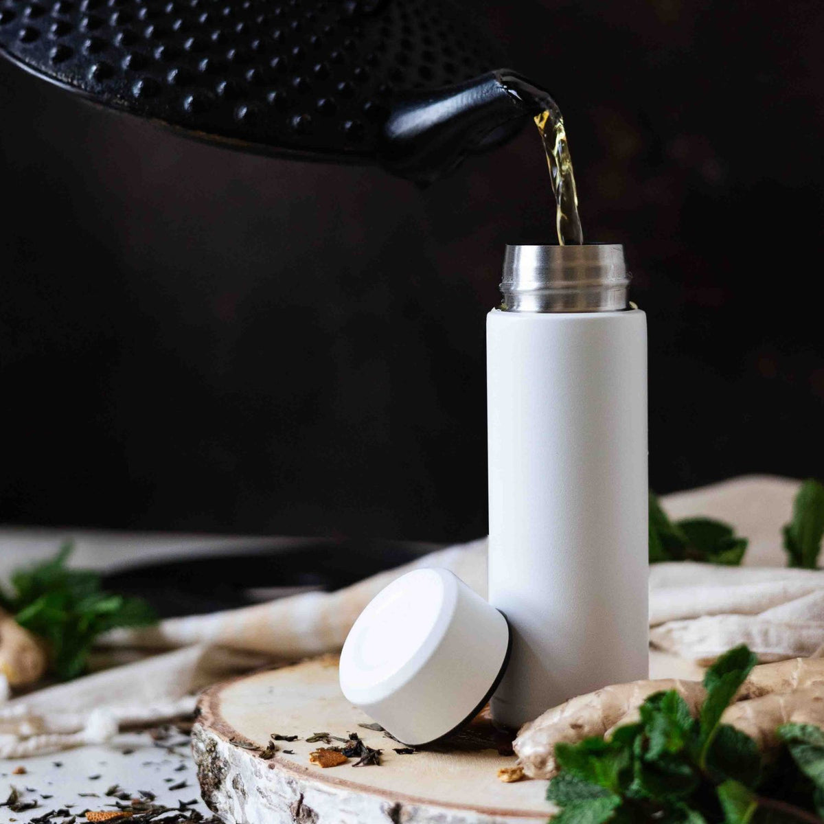 White KYOCERA Slim Mug insulated bottle with sleek design and secure lid, suitable for hot and cold beverages