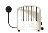 Dualit Toaster Newgen in Cremeweiß mit 4 Scheiben, modernes Design, sichtbare Toastschlitze und Bedienelemente.