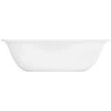 Corelle City Block white dinnerware set with plates and bowls arranged on a table, showcasing durable glass kitchen dishes.