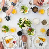 Corelle CITY BLOCK white dinnerware set with plates and bowls arranged on a table, showcasing modern ceramic dishware design.