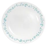 Corelle Country Cottage white dinnerware set with floral graphic design, including plates and bowls, on a neutral background.