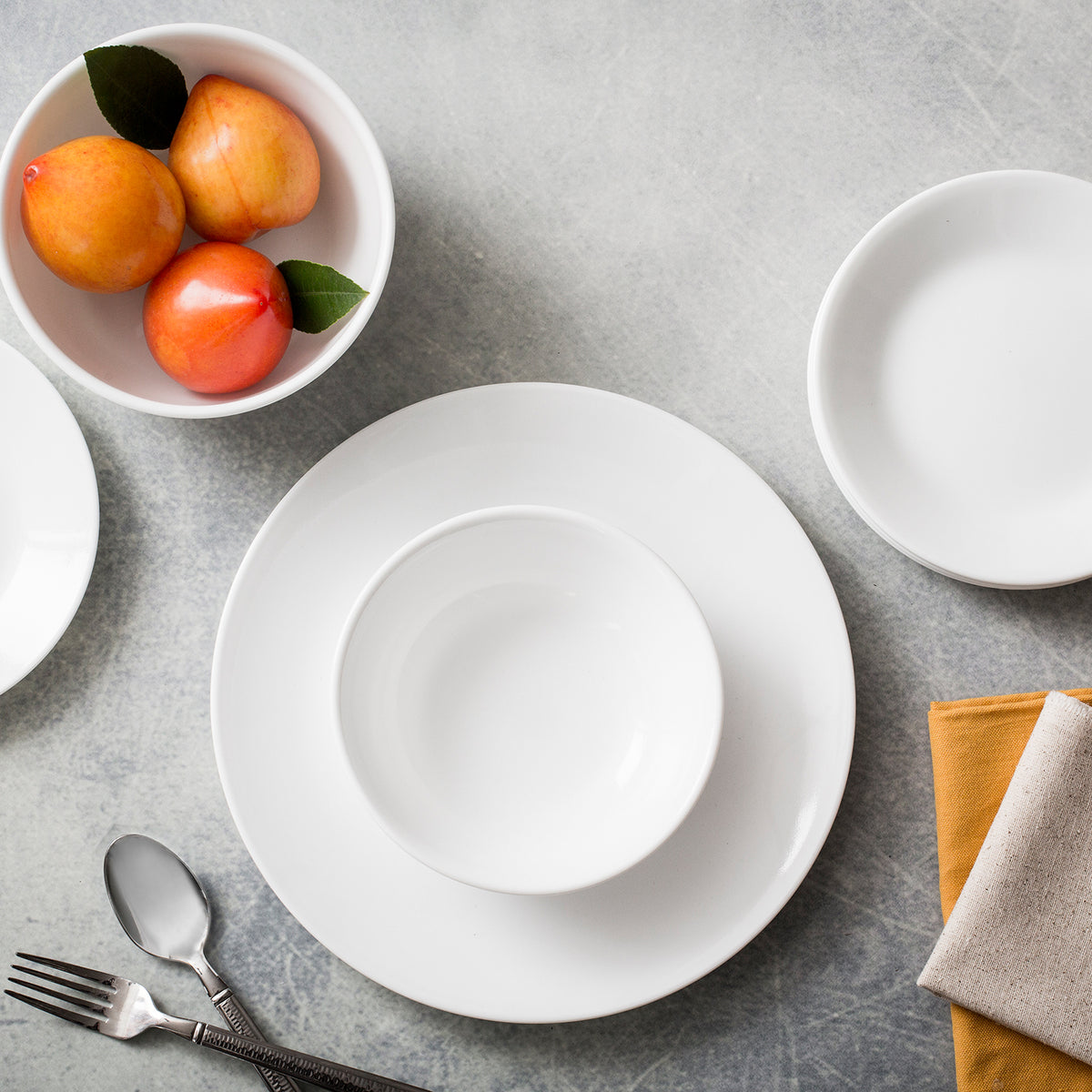 Corelle Winter Frost white dinnerware set, ceramic plates and bowls with a frosty winter design, durable and elegant for everyday use