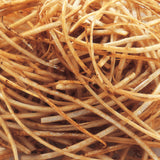 Schwarzer KYOCERA-Julienne-Hobel zum Schneiden von Gemüse in feinen Streifen, aus hochwertigem Material gefertigt.