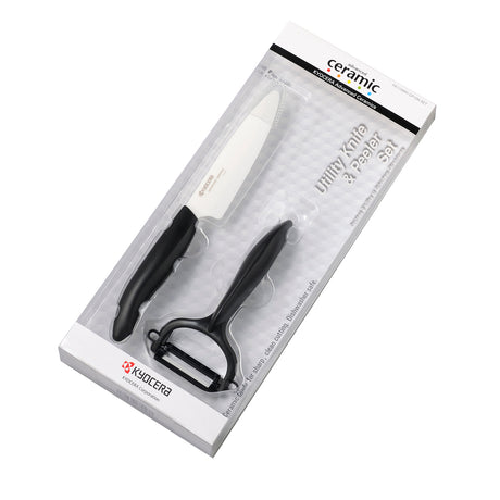 Kyocera ceramic vegetable knife set with peeler, featuring sleek white handles and sharp blades for precise kitchen prep.