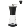 Schwarze KYOCERA Keramik-Kaffeemühle mit Deckel, Nahaufnahme der Mühle und ihrer Keramikmahlwerke.