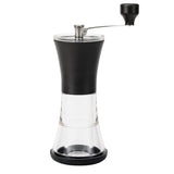 Schwarze KYOCERA Keramik-Kaffeemühle mit Deckel, Nahaufnahme der Mühle und ihrer Keramikmahlwerke.