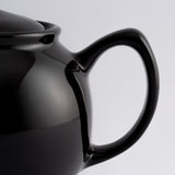 Schwarze Teekanne von PRICE & KENSINGTON aus Keramik, mit eleganter Form und Griff, für Tee-Zubereitung.