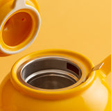 Gelbe Teekanne von PRICE & KENSINGTON aus Keramik mit elegantem Design, perfekt für Teeliebhaber.