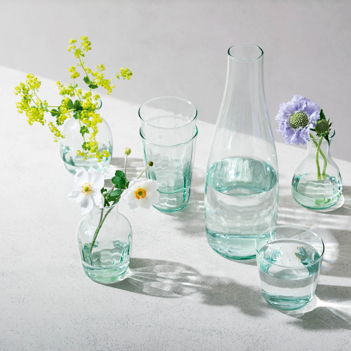 Set of four LSA Mia highball glasses, 350ml recycled glass longdrinkware with optic design, perfect for serving long drinks.
