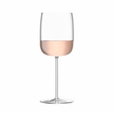 Set of four LSA Borough wine glasses, 380ml clear glass, elegant stemware for red and white wines on a white background.