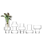 Set of five clear LSA Metropole mini vases in varying sizes (7cm to 15cm) with sleek, minimalist design.