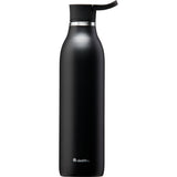 Schwarze ALADDIN Isolierflasche CITY LOOP, 600 ml, aus Edelstahl, für warme und kalte Getränke, auf einem Tisch stehend