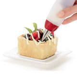 Großer CUISIPRO Silikon-Dekorierstift mit blauer Spitze zum kreativen Verzieren von Lebensmitteln und Desserts.